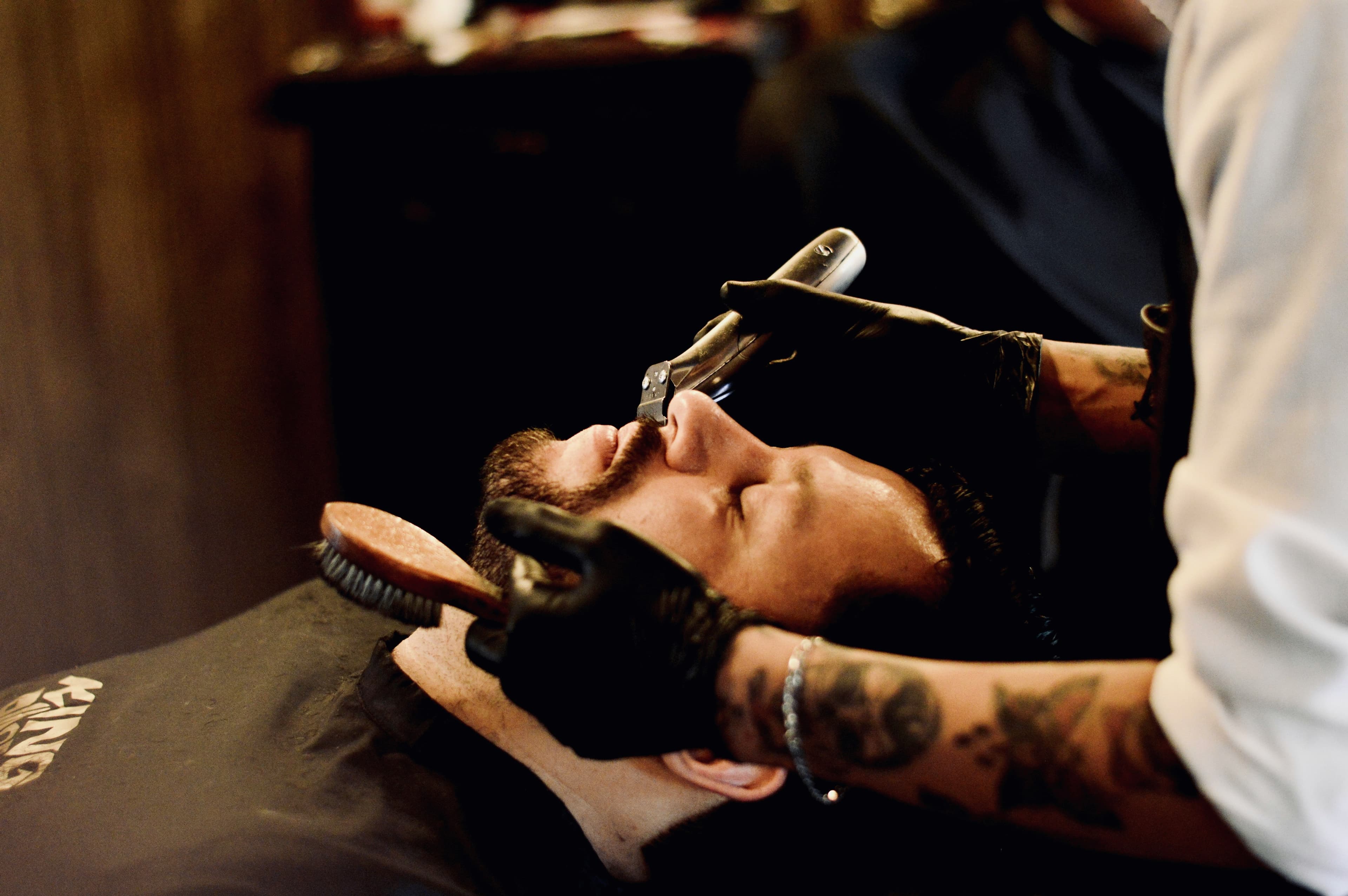 Client receiving a straight-razor shave