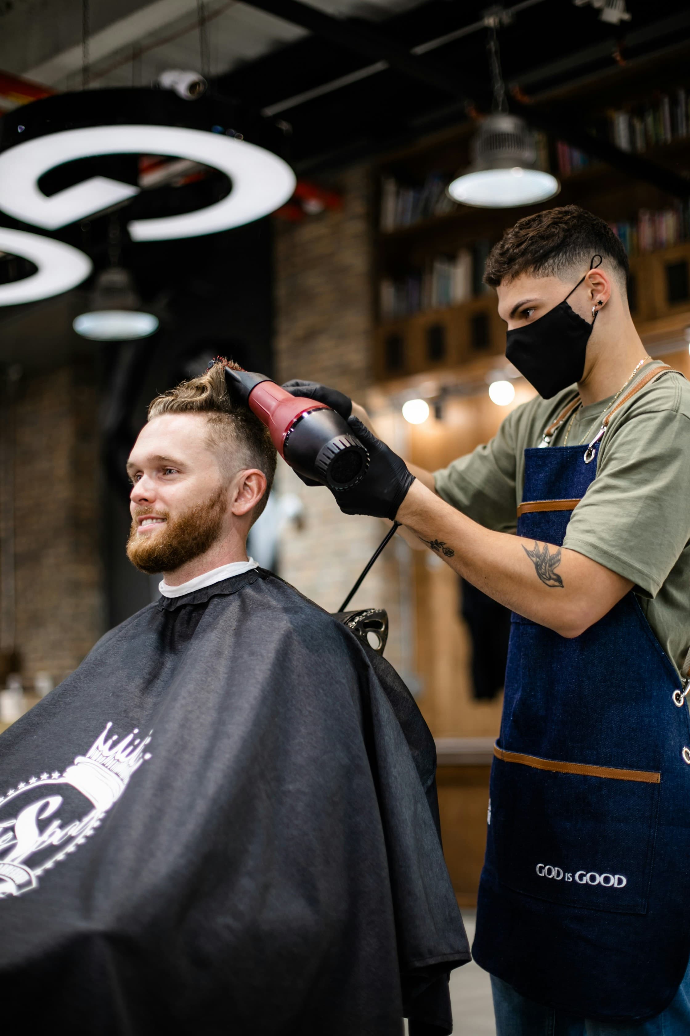 Barber styling a client's hair