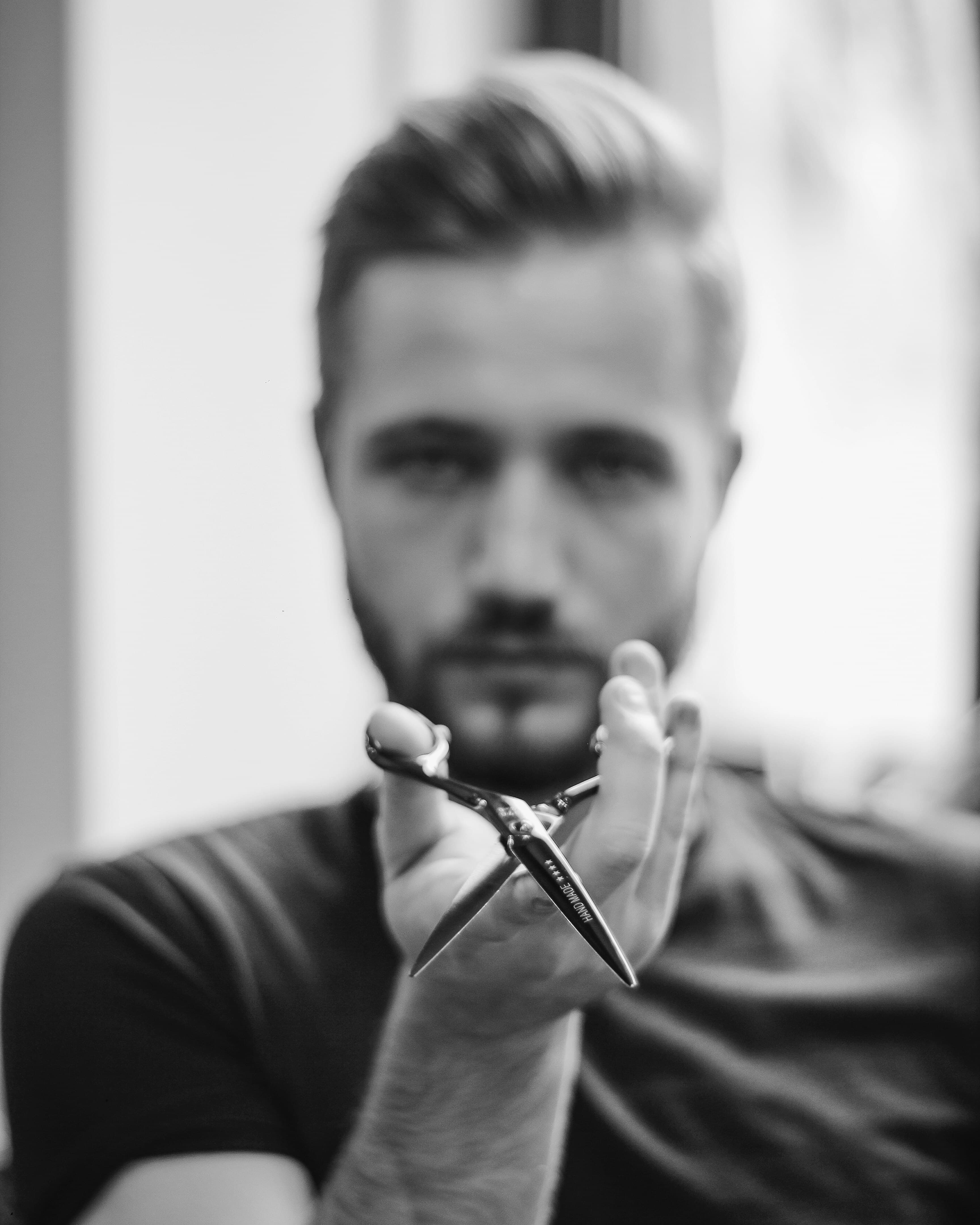 Barber giving a client a precise fade