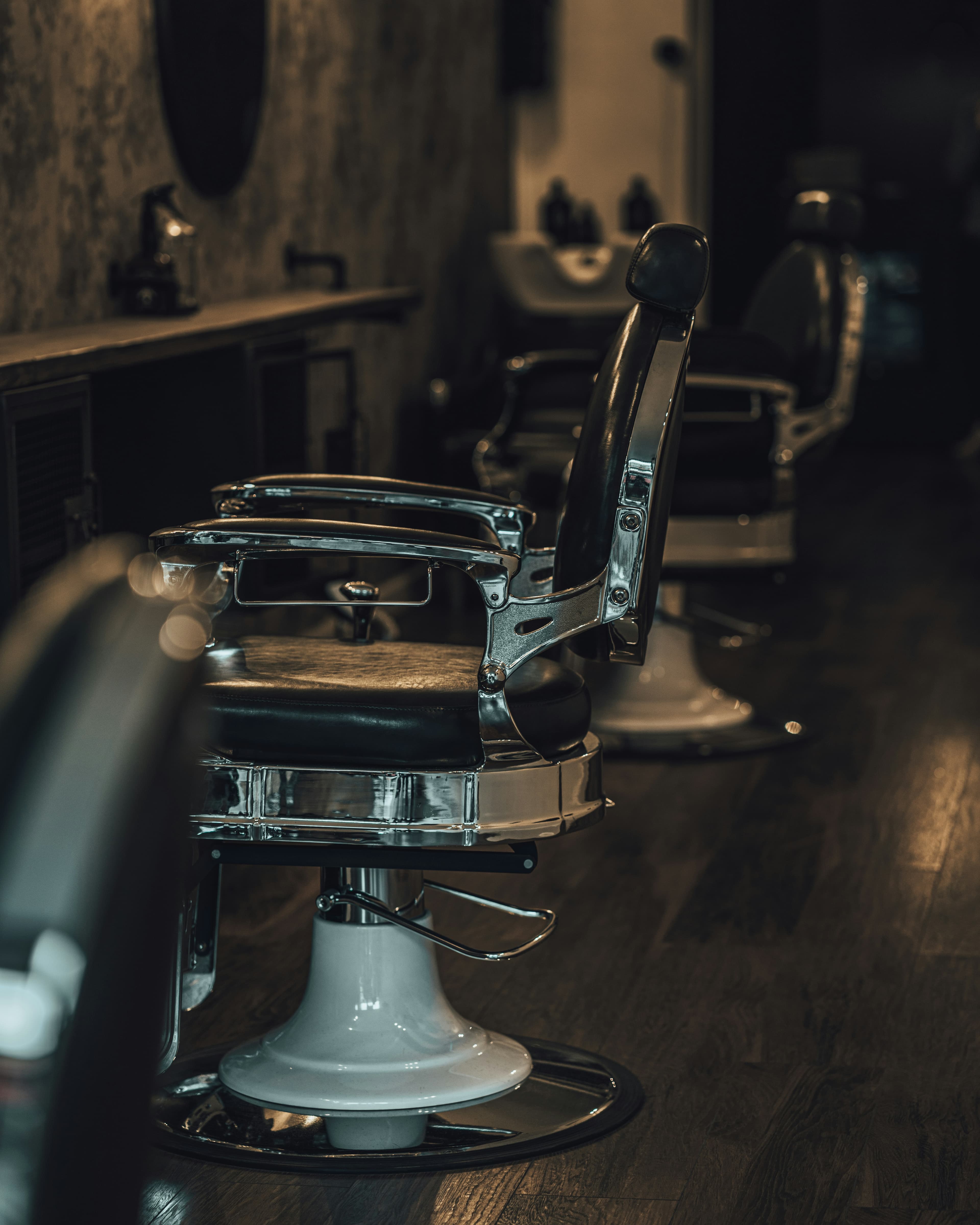 Classic barber chairs in a moody barbershop interior